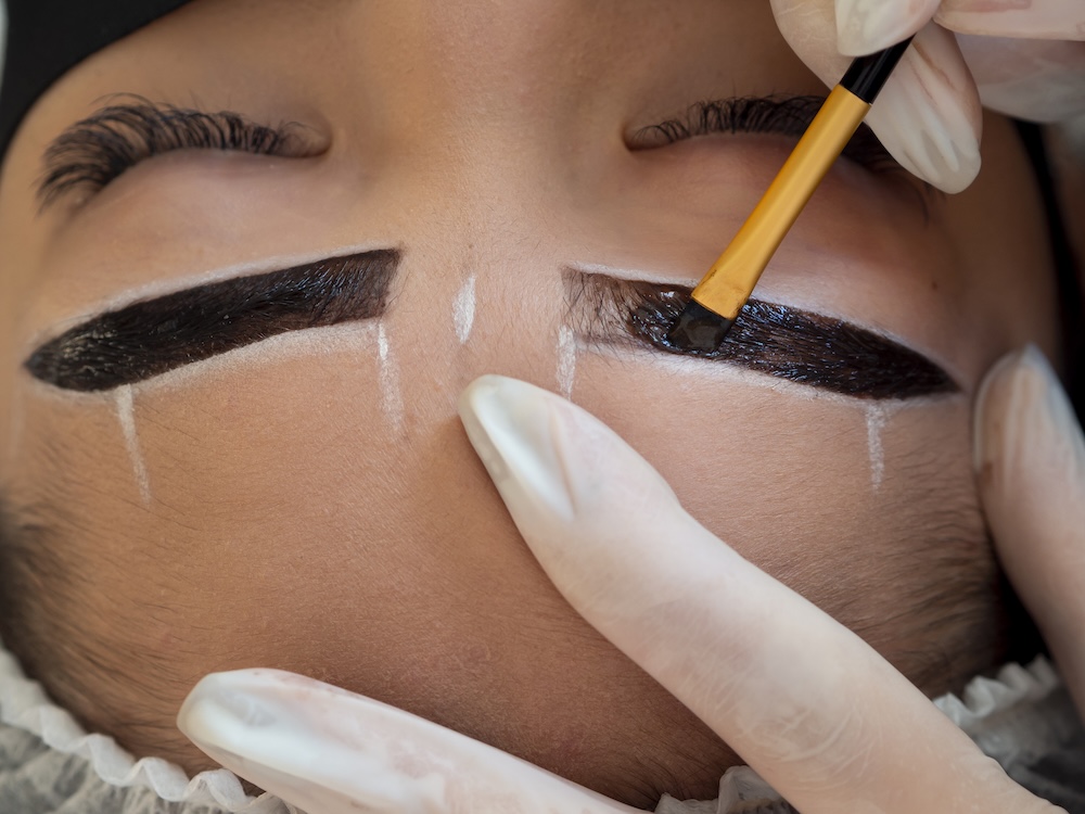 Woman getting her brows tinted